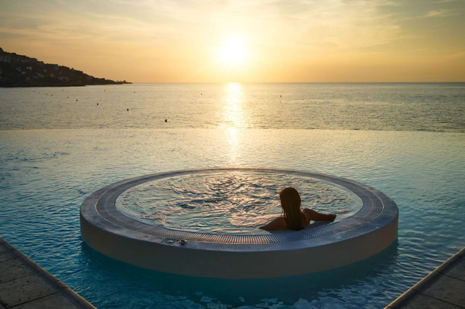 Cap Estel wedding venue infinity pool at sunset