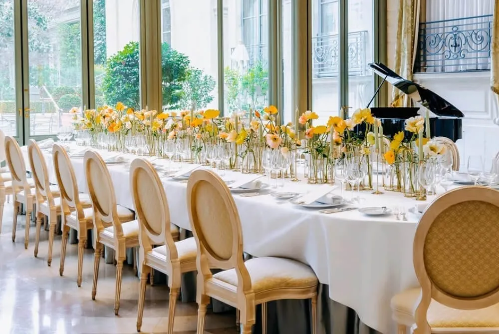 Ritz Paris wedding yellow flowers on a long table in the Salon d'Ete