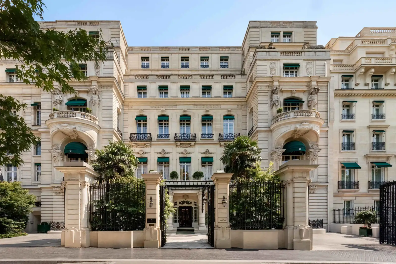 The Shangri-La Paris on avenue d'Iéna, the 1896 mansion of Prince Roland Bonaparte behind its gates and green awnings