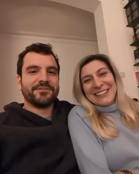 Deborah and Louis at home, talking about their wedding